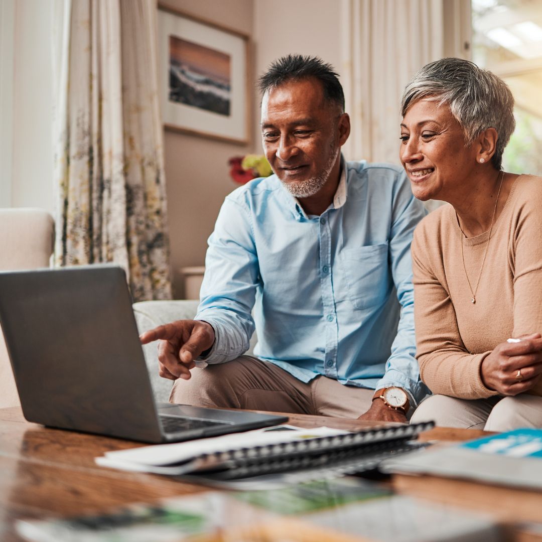 man and woman looking at a computer