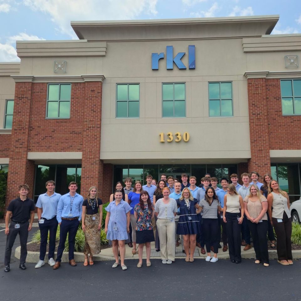 RKL interns posing in front of RKL building