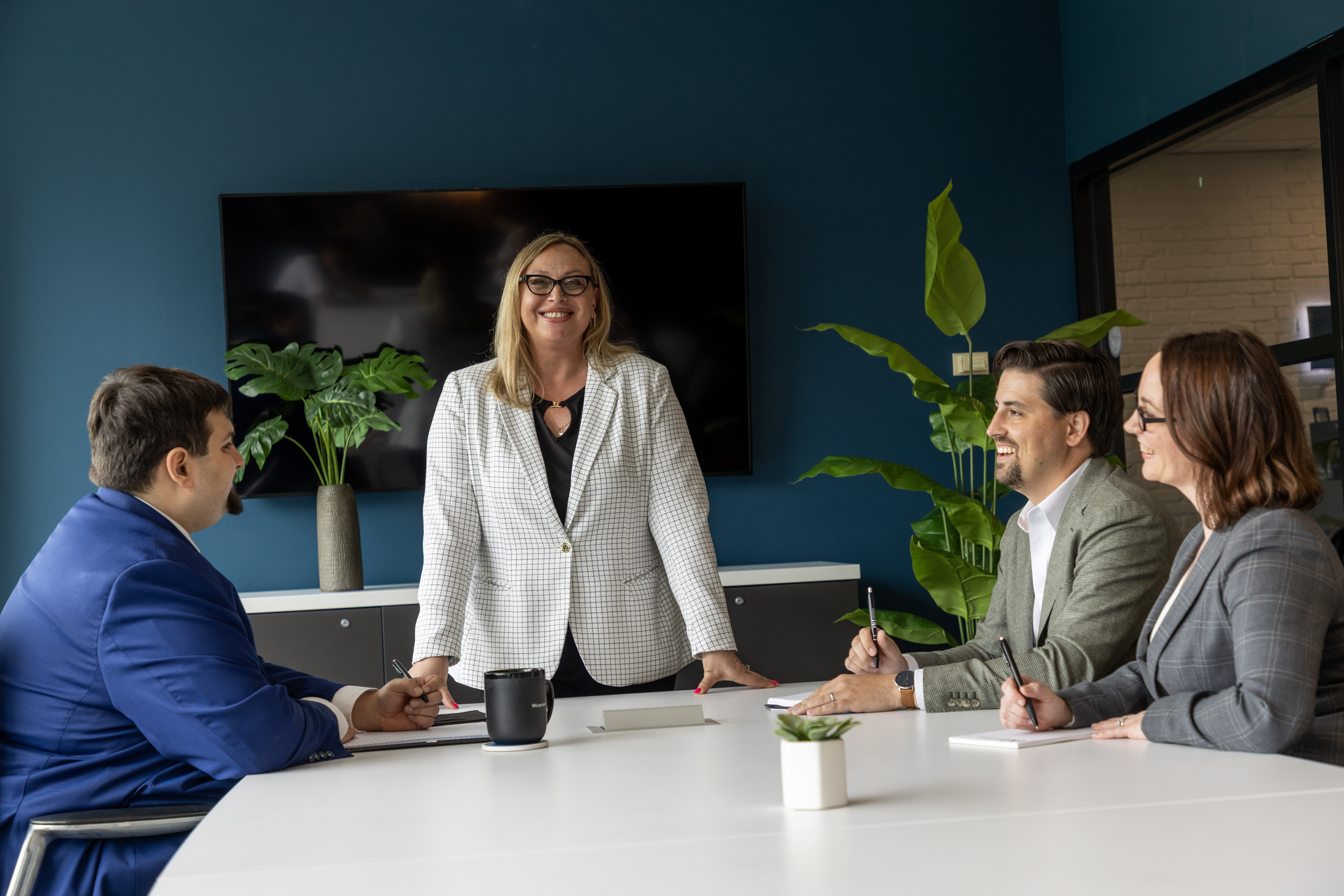 four people at a conference table