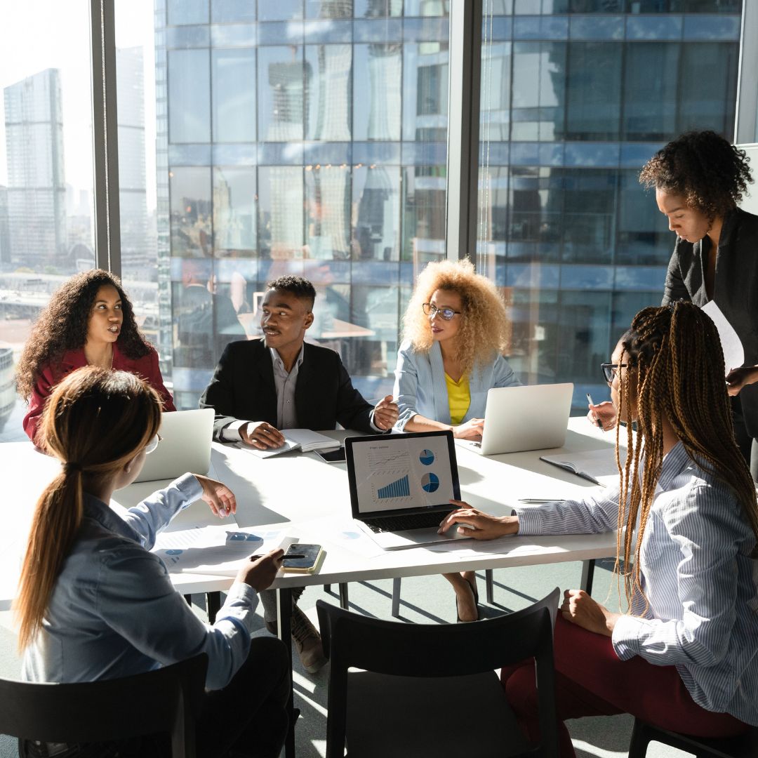 group of people discussing retirement plans at a conference table