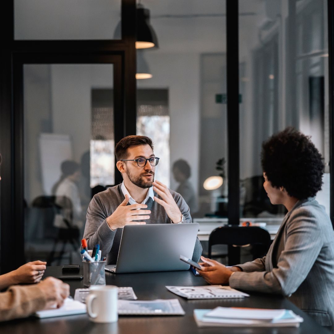 two people discussing retirement plans at a conference table