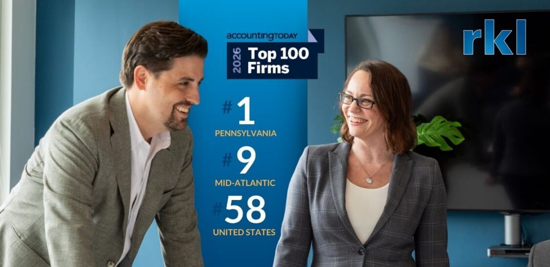 RKL Ranked Top 100 Firms by Accounting Today Image of man and woman smiling in an office
